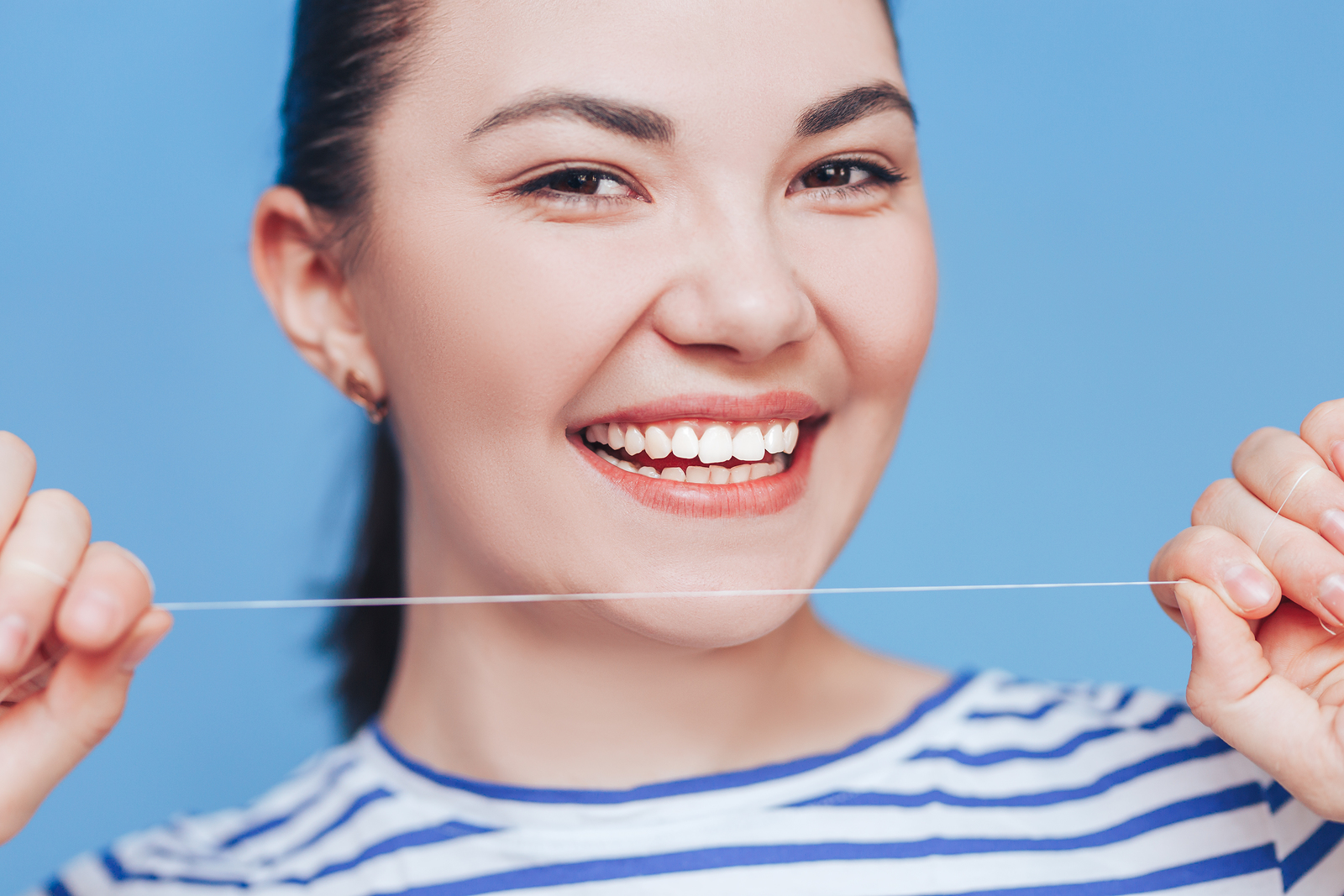 If My Gums Bleed, Should I Stop Flossing?